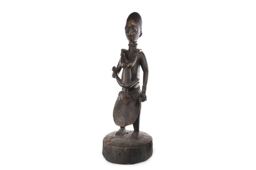 Lot 1083 - AN AFRICAN CARVED WOOD FIGURE OF A FEMALE