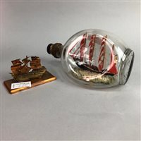 Lot 267 - A MODEL SHIP, A SHIP IN A BOTTLE AND A COPPER MODEL OF A SHIP