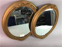 Lot 248 - A PAIR OF GILT OVAL WALL MIRRORS AND ANOTHER
