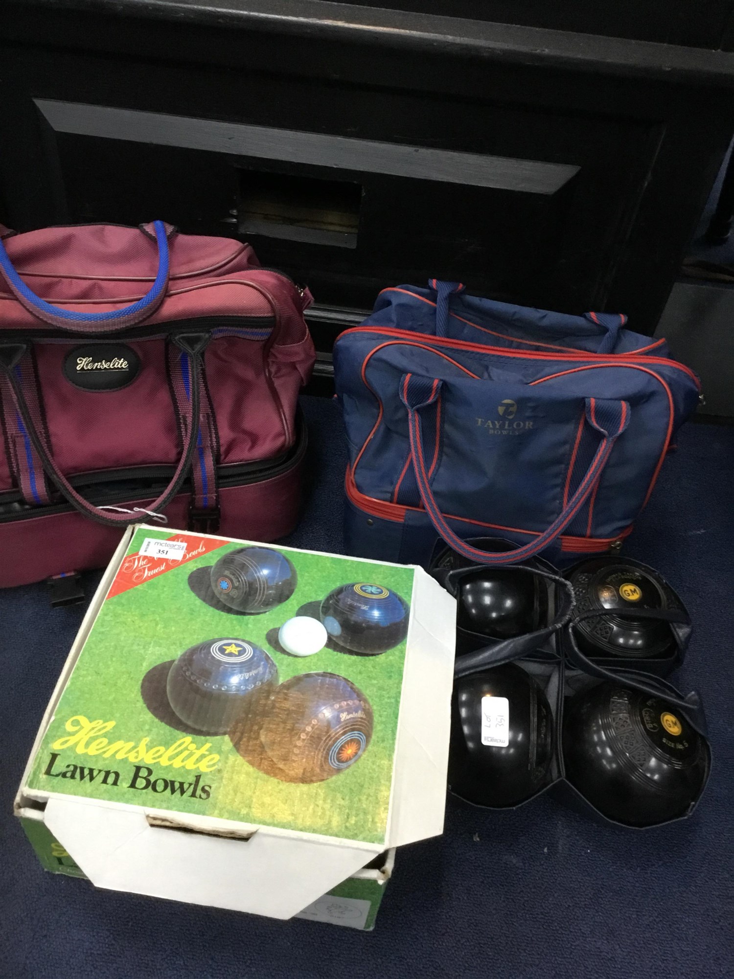 Lot 351 A LOT OF FOUR SETS OF LAWN BOWLS