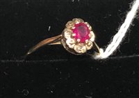Lot 363 - A RUBY AND DIAMOND NINE CARAT GOLD RING