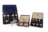Lot 864 - A LOT OF THREE PAIRS OF SILVER TOAST RACKS WITH A SET OF COFFEE SPOONS AND SET OF TEASPOONS