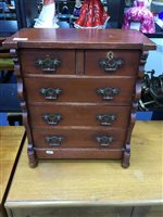 Lot 134 - A MAHOGANY MINIATURE CHEST