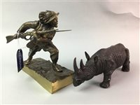 Lot 84 - A BRONZE RHINOCEROS AND A FIGURE OF A SOLDIER