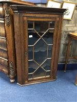 Lot 154 - AN OAK GLAZED CORNER CABINET