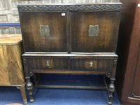 Lot 110 - AN EARLY 20TH CENTURY OAK FOUR DOOR DRINKS CABINET