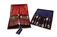 Lot 860 - A LOT OF TWO SETS OF SILVER TEASPOONS WITH TONGS