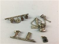 Lot 261 - A LOT OF CHINESE WHITE METAL CHARMS