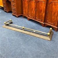 Lot 273 - A BRASS AND CAST IRON FIRE FENDER