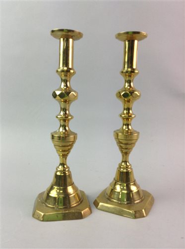 Lot 135 - A PAIR OF BRASS CANDLESTICKS AND THREE FIGURES OF LADIES