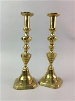 Lot 135 - A PAIR OF BRASS CANDLESTICKS AND THREE FIGURES OF LADIES