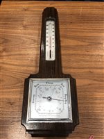 Lot 324 - AN OAK WALL BAROMETER