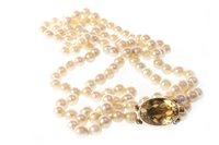 Lot 136 - A PEARL NECKLACE WITH GEM SET CLASP