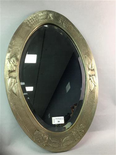 Lot 30 - AN OVAL BEVELLED MIRROR