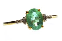Lot 23 - A GREEN GEM AND DIAMOND RING