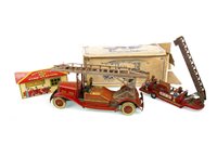 Lot 1732 - AN EARLY 20TH CENTURY TIN PLATE CLOCKWORK FIRE ENGINE, ANOTHER FIRE ENGINE AND A FIRE STATION