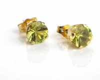Lot 12 - PAIR OF PERIDOT STUD EARRINGS each set with a...