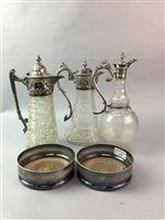 Lot 144 - A PAIR OF SILVER PLATED WINE SLIDES AND THREE CLARET JUGS