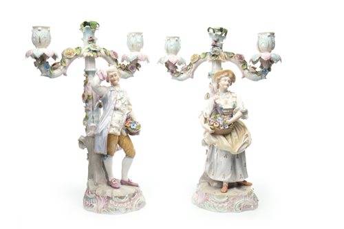 Lot 1239 - A PAIR OF GERMAN PORCELAIN FIGURAL CANDELABRA IN THE STYLE OF MEISSEN