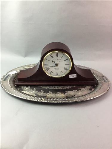 Lot 175 - A SILVER PLATED SERVING TRAY AND A MANTEL CLOCK