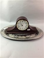 Lot 175 - A SILVER PLATED SERVING TRAY AND A MANTEL CLOCK