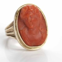 Lot 43 - NINETEENTH CENTURY RED CORAL CAMEO RING carved...