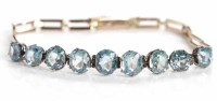 Lot 53 - EARLY TWENTIETH CENTURY BLUE ZIRCON BRACELET...