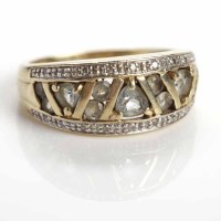 Lot 61 - DIAMOND DRESS RING channel set with brilliant...