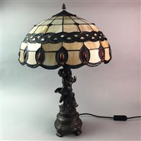 Lot 63 - A PAIR OF FIGURAL TABLE LAMPS WITH LEADED GLASS SHADES