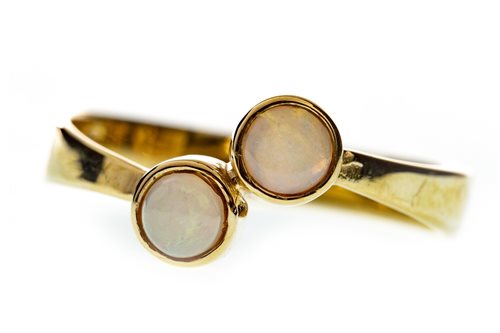 Lot 166 - AN OPAL TWO STONE RING