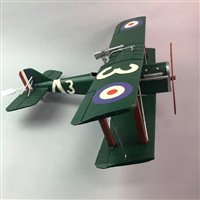 Lot 85 - A CAST IRON FLYING SCOTSMANS RAILWAY SIGN AND A TINPLATE MODEL BIPLANE