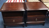 Lot 202 - A PAIR OF STAG BEDSIDE TABLES AND A DOUBLE BED HEADBOARD