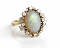 Lot 103 - LARGE OPAL AND DIAMOND CLUSTER RING with a...