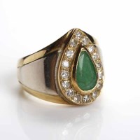Lot 104 - EMERALD AND DIAMOND CLUSTER RING set centrally...