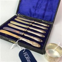 Lot 28 - A SET OF SIX SILVER HANDLED BUTTER KNIVES AND A SILVER NAPKIN RING