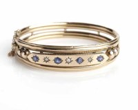 Lot 129 - VICTORIAN SAPPHIRE AND DIAMOND BANGLE set with...