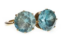 Lot 92 - A BLUE GEM SET TWO STONE RING