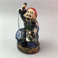 Lot 328 - A CERAMIC FIGURE OF A WORKMAN WITH MALLET