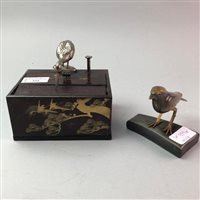 Lot 333 - A JAPANESE NOVELTY CIGARETTE BOX AND A CARVED HORN BIRD FIGURE