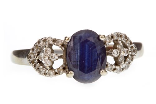 Lot 137 - A BLUE GEM AND DIAMOND RING