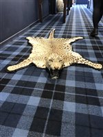 Lot 824 - A LATE 19TH/EARLY 20TH CENTURY LEOPARD SKIN RUG