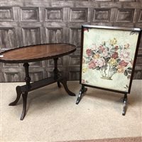 Lot 96 - AN OVAL COFFEE TABLE AND A FIRESCREEN