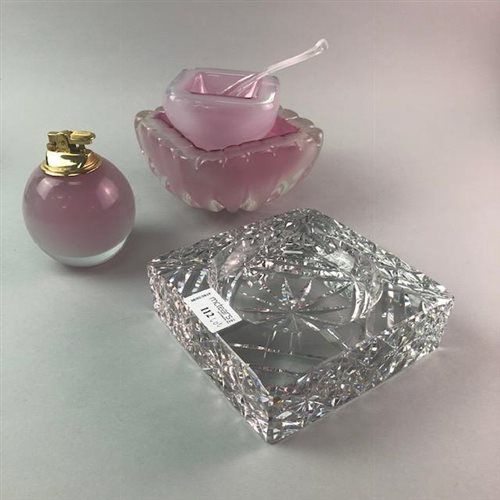 Lot 112 - A GLASS PAPERWEIGHT, ASHTRAY AND LIGHTER