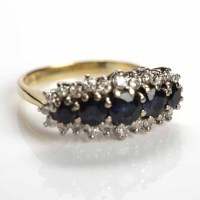 Lot 179 - FIVE STONE SAPPHIRE AND DIAMOND CLUSTER RING...