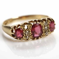 Lot 192 - RUBY AND DIAMOND RING set with three oval...