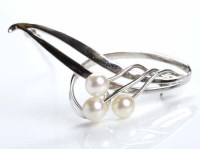 Lot 193 - MIKIMOTO PEARL BROOCH of scrolling foliate...