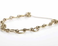 Lot 203 - NINE CARAT GOLD BRACELET formed by oval links...