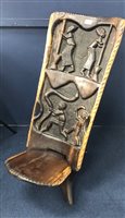 Lot 185 - AN AFRICAN CARVED CHAIR