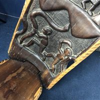 Lot 185 - AN AFRICAN CARVED CHAIR