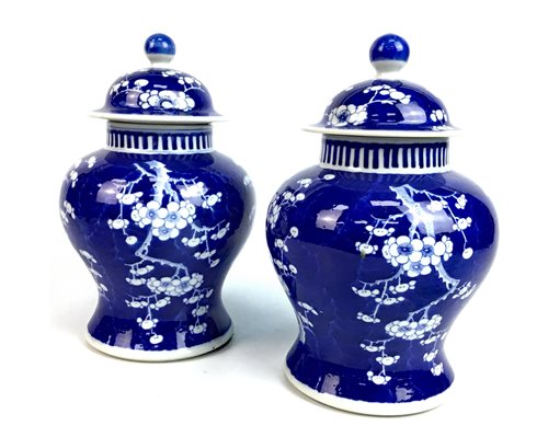 Lot 1037 - A PAIR OF CHINESE LIDDED VASES